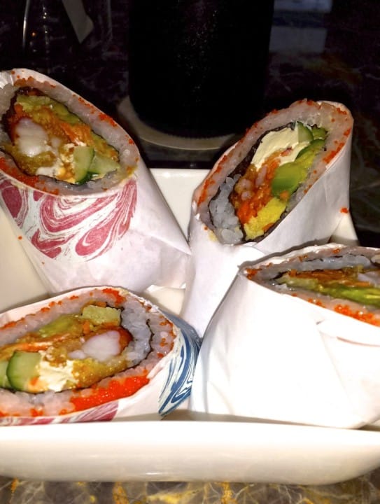 A long sushi wrap almost Mexican in look, but unwrap it and there she is - sushi roll 