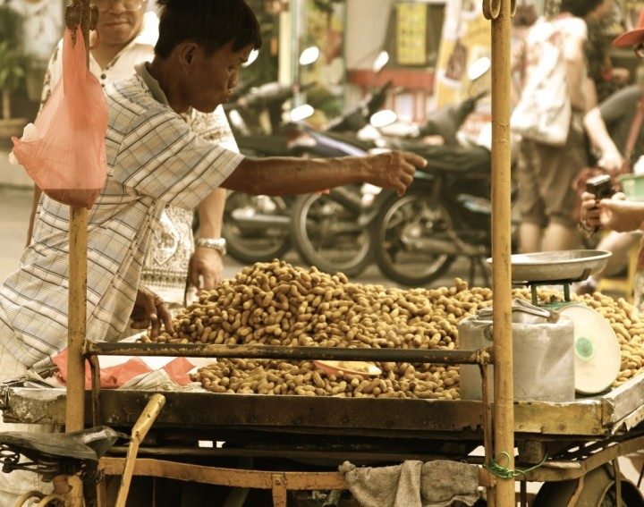 Here every year, this guy sells the same sweetened, stewed monkey nuts. Just the thought of them makes you want to reach for a beer