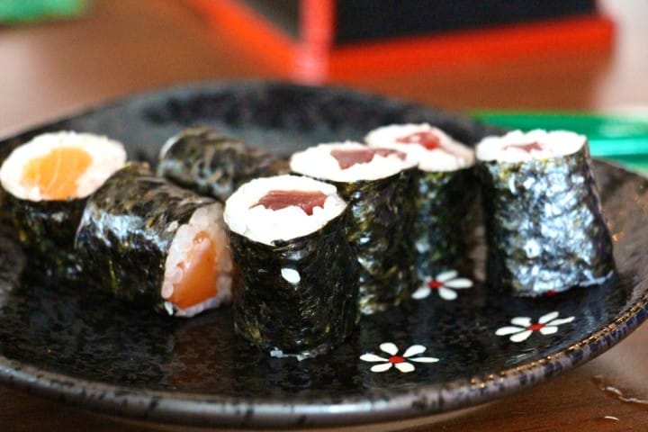 Out comes dish number one - salmon and tuna 'maki'. Small rolls of seaweed covered rice and raw fish. Now who ordered that???