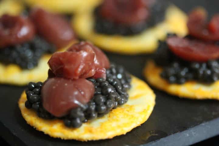 Caviar, with Morello sour Cherries on Cheese Crackers