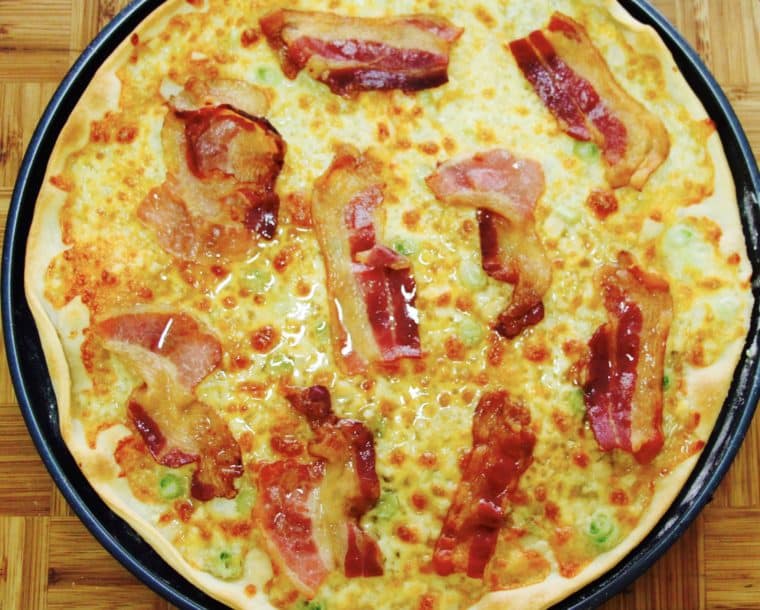 Breakfast Pizza with cheese, garlic, bacon and Maple syrup