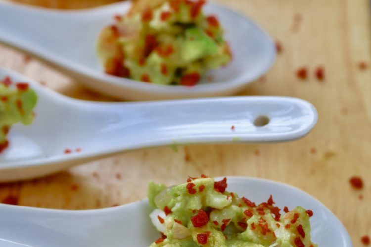 Avocado with prawns, lime, coriander and bacon bits