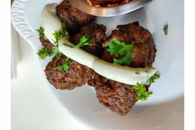 LAMB-MEATBALLS-in-house-made-meatballs-with-a-side-of-spicy-harissa-dip-lemon-yogurt-dressing