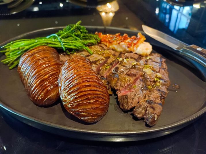 Surf & Turf Maine Lobster with Chicken Fat Glaze Wandrered Barley Fed Beef Ribeye Hasselback Potatoes Broccolini Asparagus