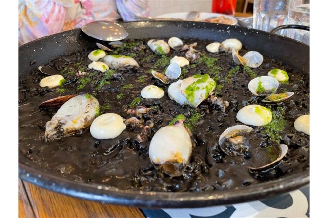 next door spanish cafe squid ink paella with clamari and clams Next Door Spanish Cafe