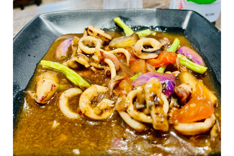 Lola J Kusinang Pinoy Restaurant Adobong Pusit S$ 12.50 Squid stewed in tangy sauce & squid ink