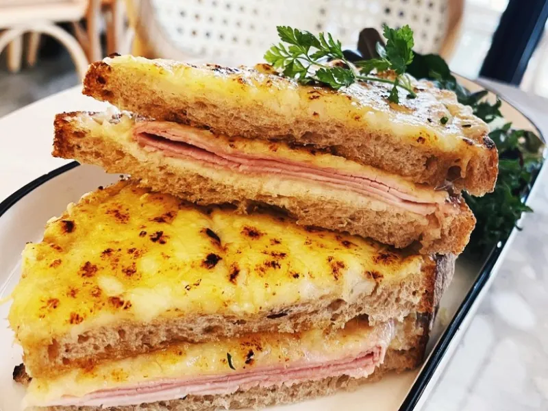 Croque Monsieur, a grilled ham and cheese sandwich with sourdough toast