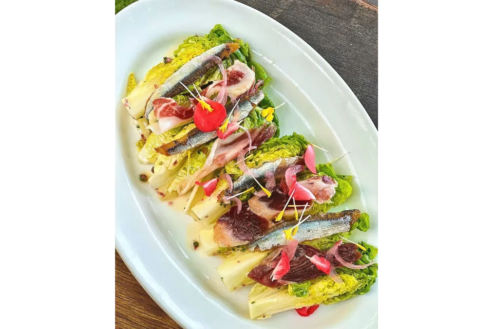 foc sentosa best spanish restaurants in singapore baby gem salad with smoked anchovies and iberico ham