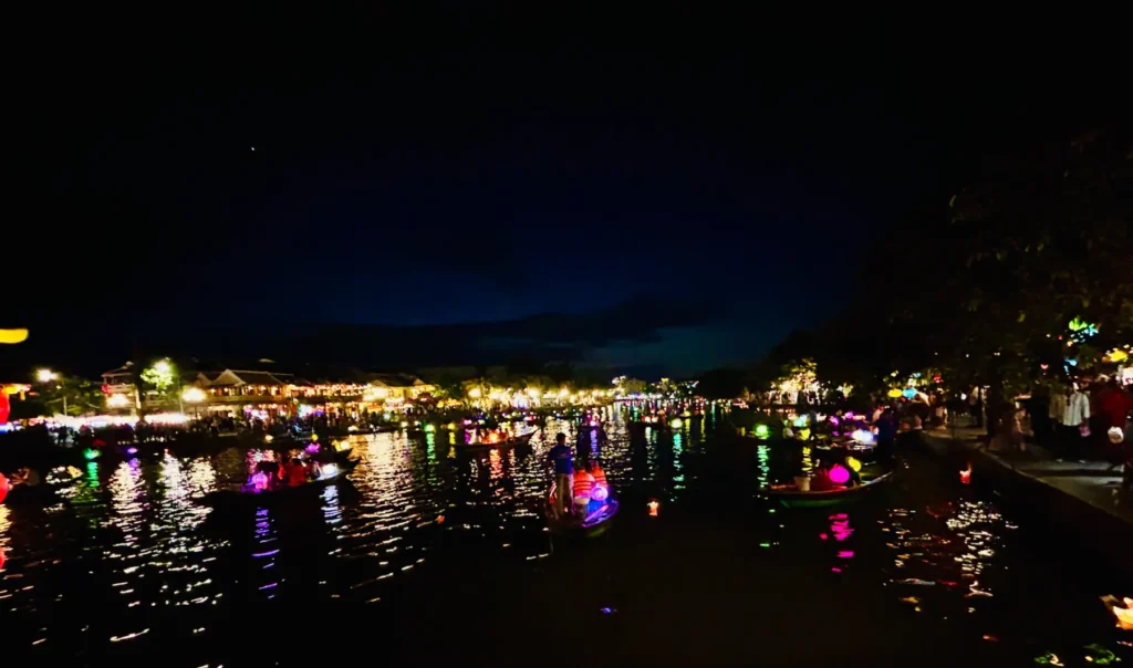 what to do in hoi an moody shot of lights on the river hoi an