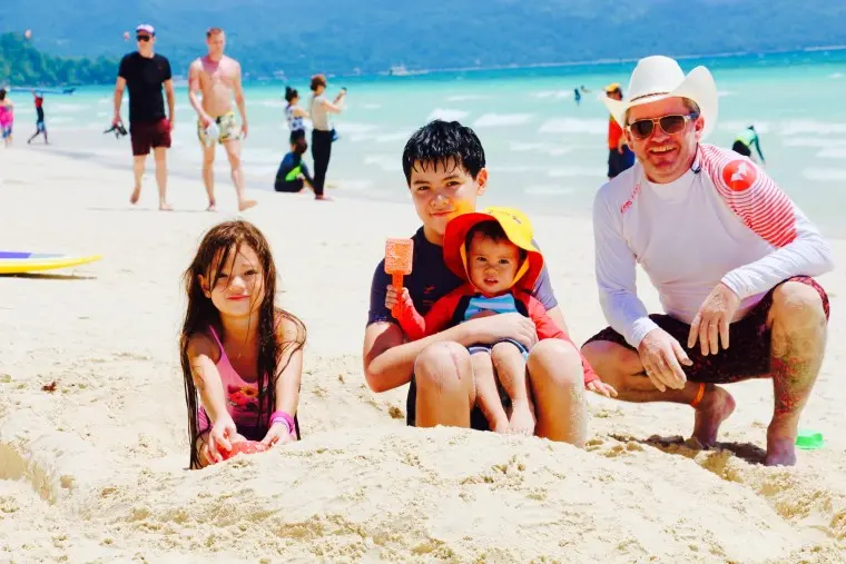 boracay review family on the beach digging in the sand