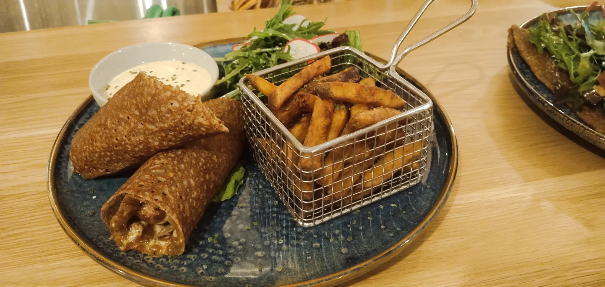 French Fold Great World Review 15 French Fold Great World Review Grilled pork sausage wrapped in a buckwheat crêpe with fries at French Fold Great World