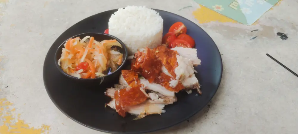 Lechon Baboy with rice and green papaya salad